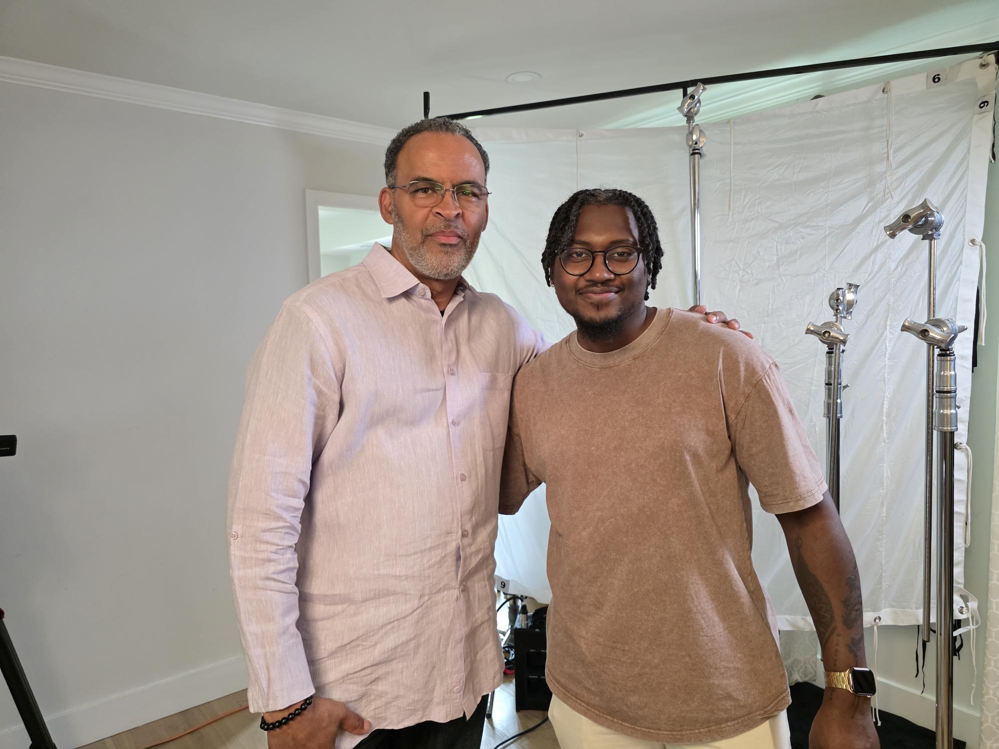 Director with a crew member on set