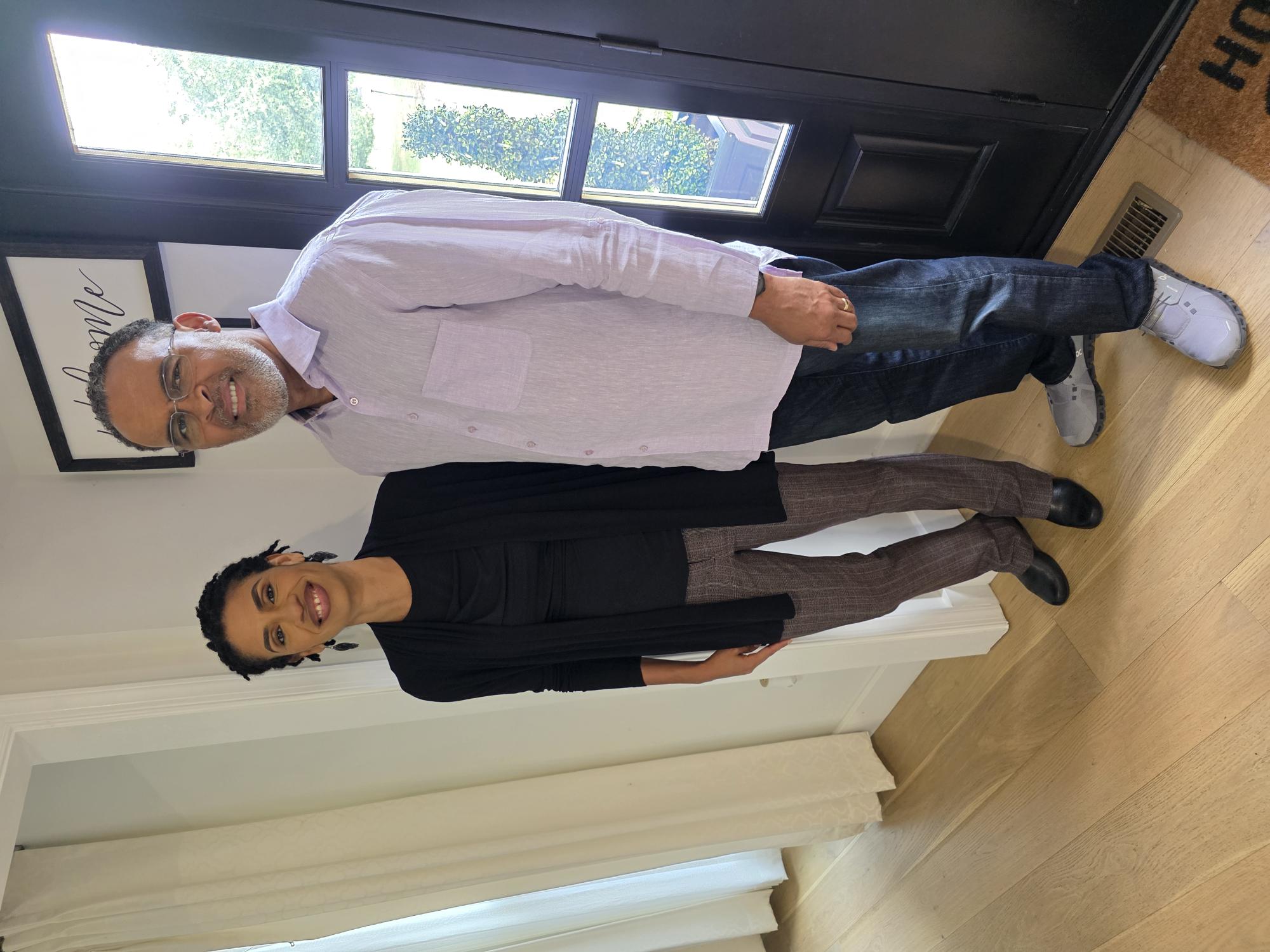 Director with an interview participant at home