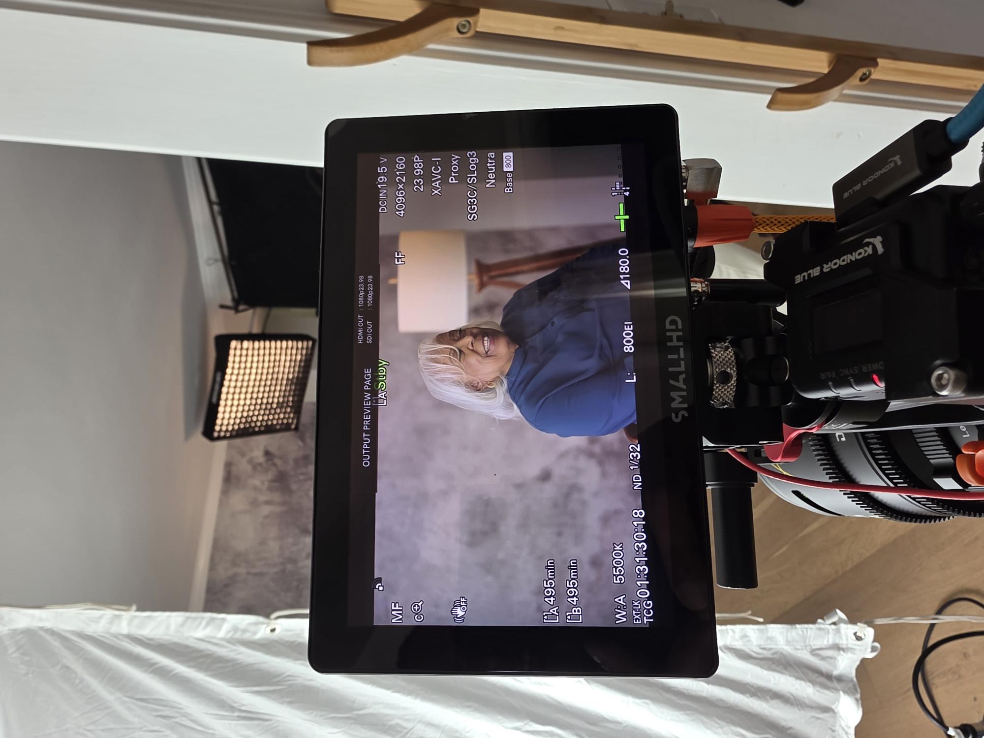 Interview subject framed on the camera monitor